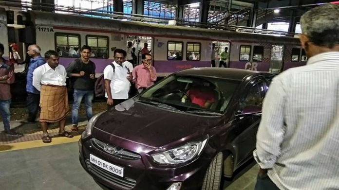 cricket player drove car in railway platform