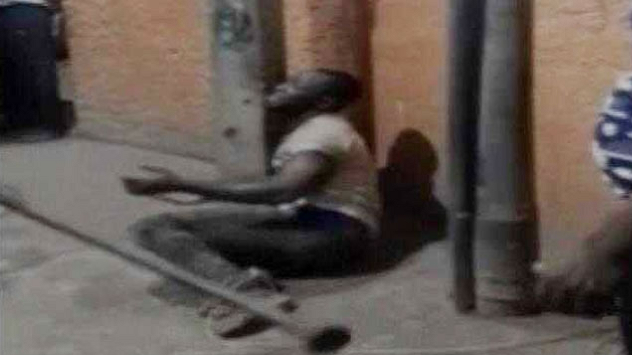 Nigerian Tied To Post (1)