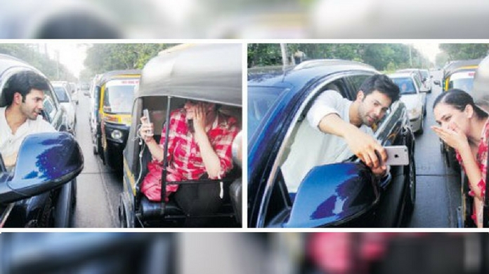 varun dhawan fined for taking selfi during traffic block
