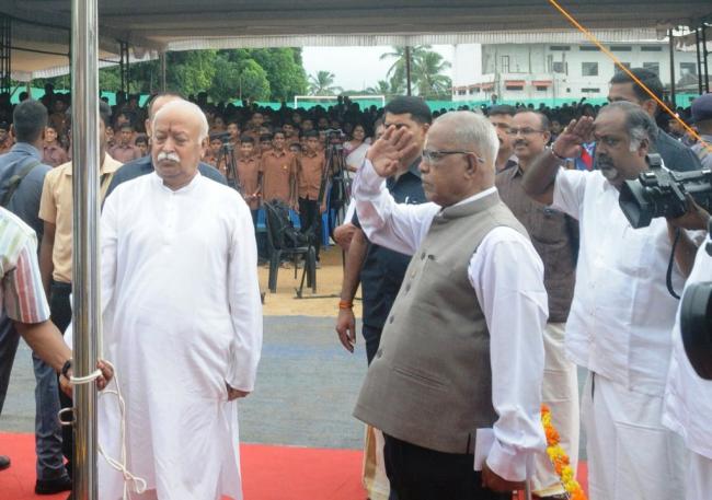 pinarayi vijayan ordered to take action against mohan bhagwat for hoisting flag in school