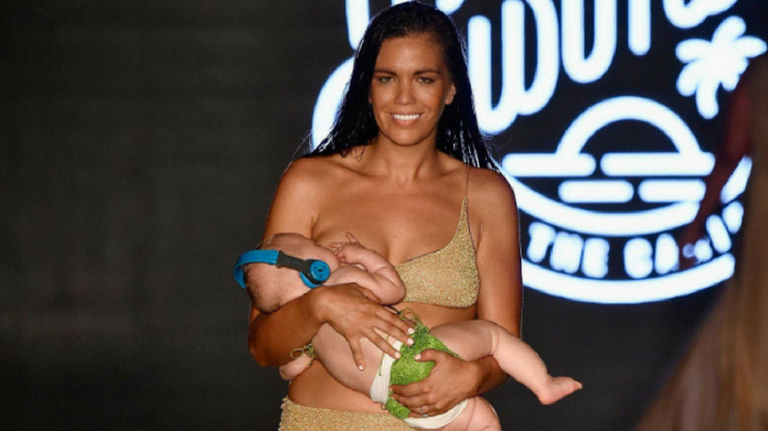 model feeds baby on ramp