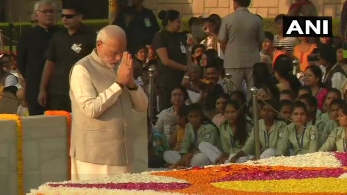 narendra modi pays tribute to mahatma gandhi at rajghat