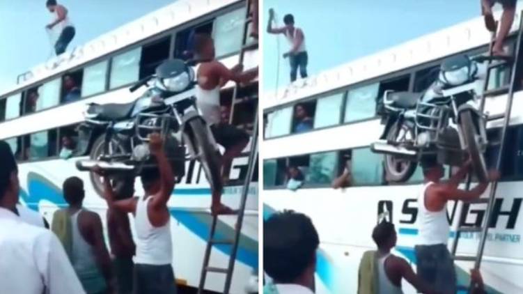 Man climbs ladder with a bike on his head video goes viral