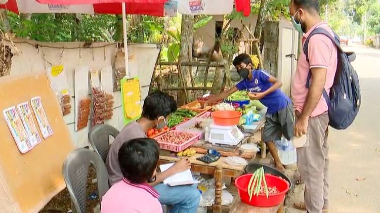 children selling vegetables to help father