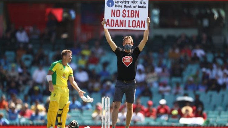 Protesters ground banner Adani