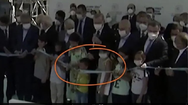 Boy Cuts Ribbon Turkish