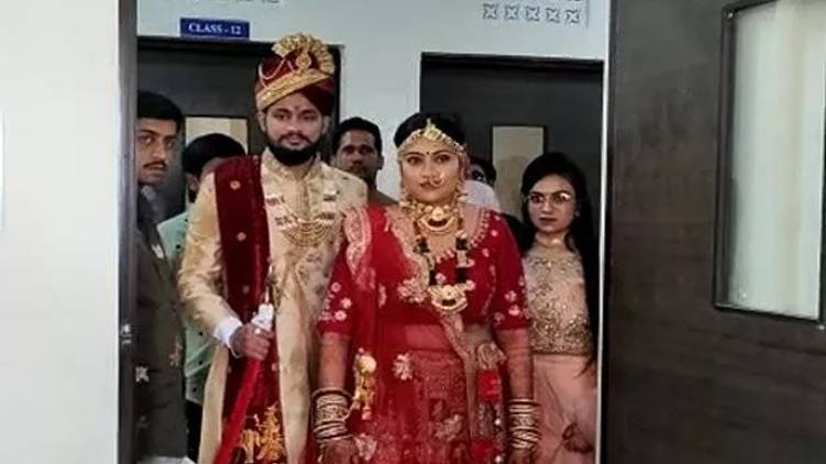 girl writes exam in bridal dress