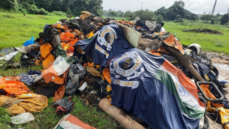 national flag on garbage heap three arrested