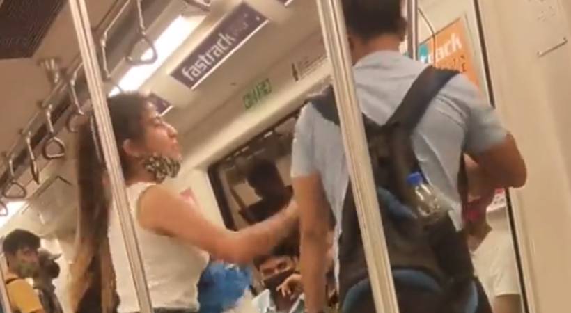 couple fight over t shirt in metro