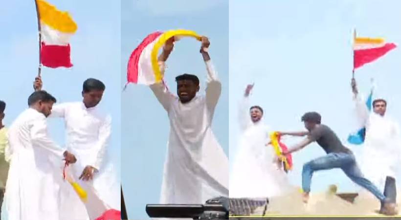 vizhinjam protest pastor waves flag