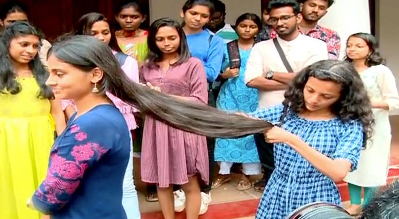 Students protest on campus by cutting their hair