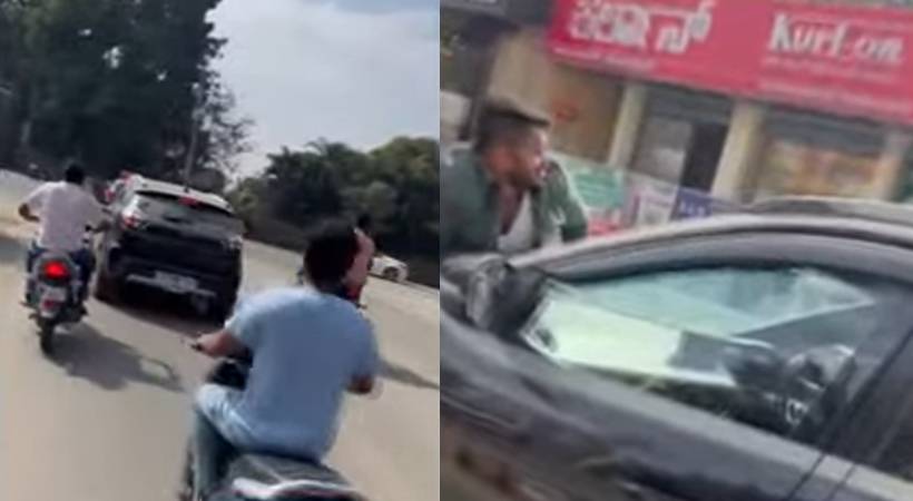 woman drives with man on car bonnet