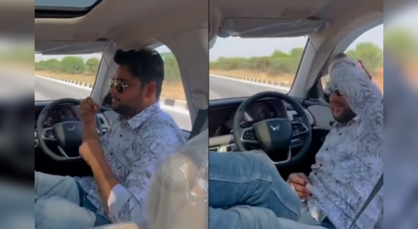 Man leaves car's steering wheel while driving