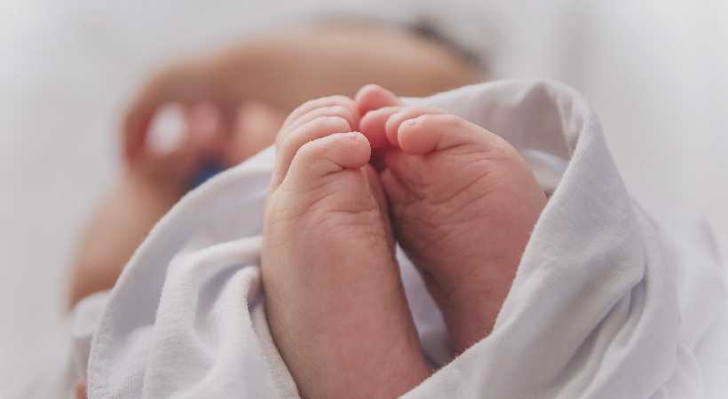 Baby with DNA from three people born in Britain