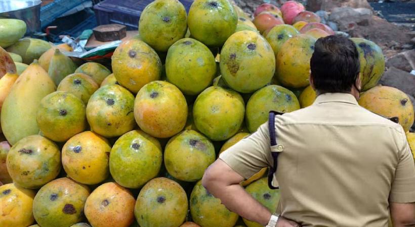 Policeman buying mangoes and not paying