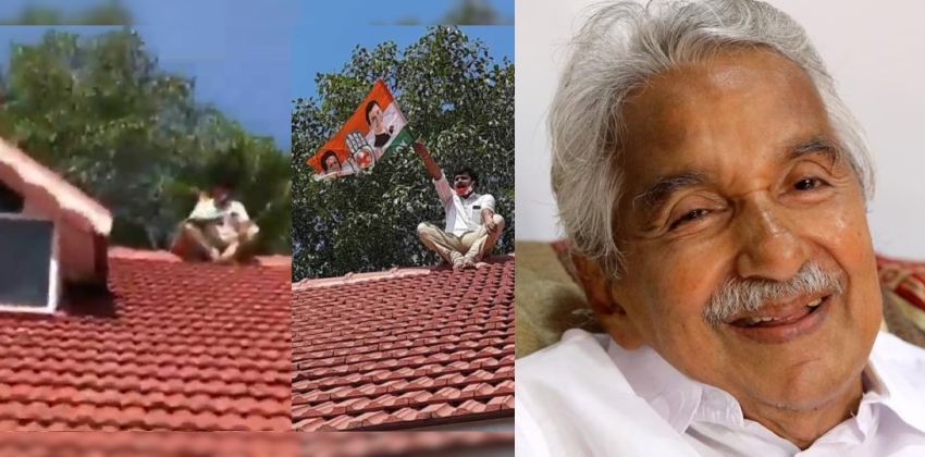 Congress worker climb on Oommen chandys house (1)