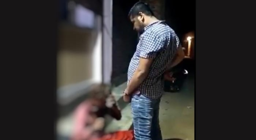 bjp leader urinate adivasi police