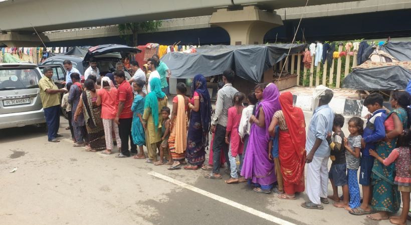 Delhi Malayali Association distributed food packs to flood victims