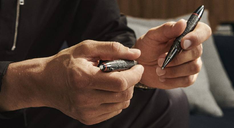Policeman seized defendant's pen worth rs 60000