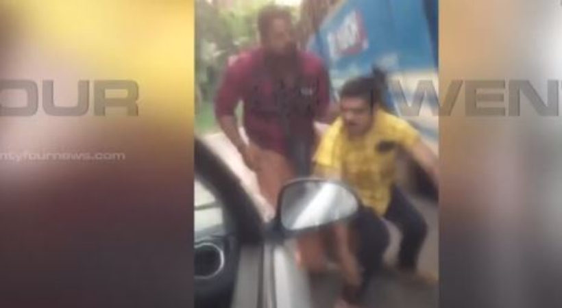 Bus employees beat car driver at Kozhikode