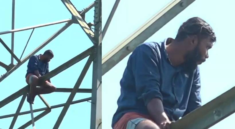 suicide threat by climbing on electric tower