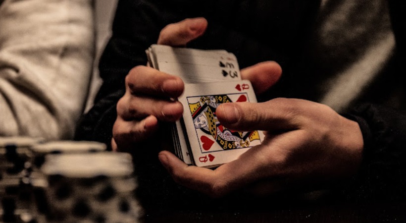 Playing cards with money in congress office